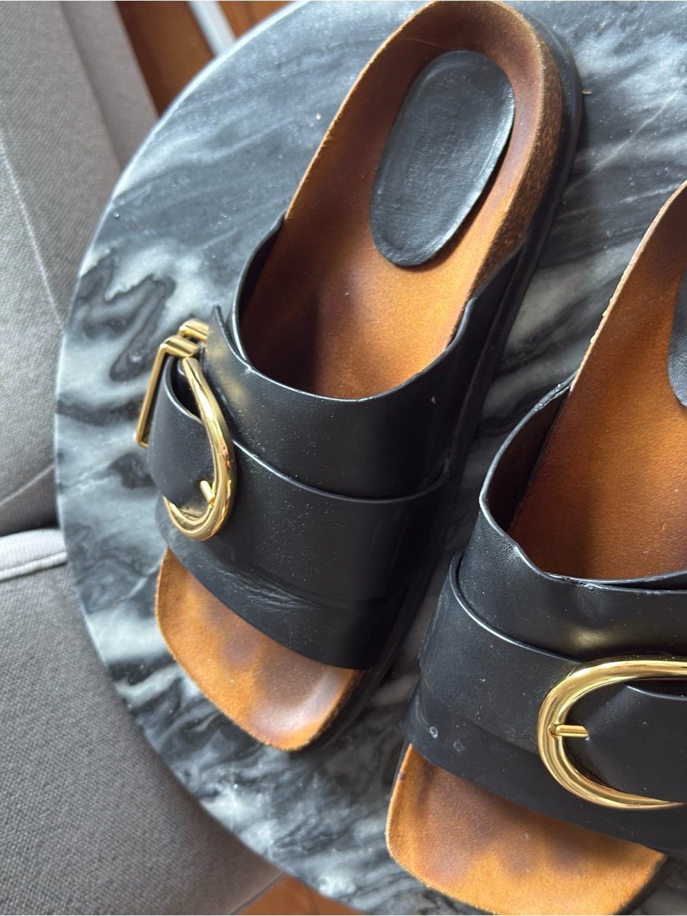 KHAITE Black Slide Sandals with Gold Buckle